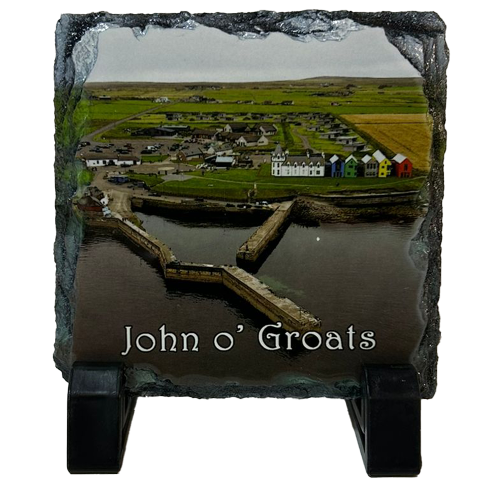 Slate coaster with a scenic view of John o' Groats and engraved text on a white background
