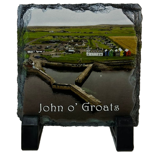 Slate coaster with a scenic view of John o' Groats and engraved text on a white background